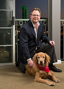 Photo of Jeff with his loyal canine, Au Sabel, named after the famous river in Michigan